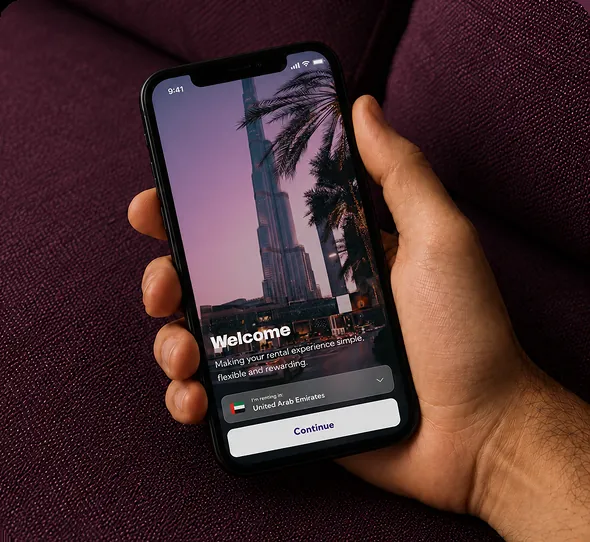 The Rently app's welcome screen shown on a phone